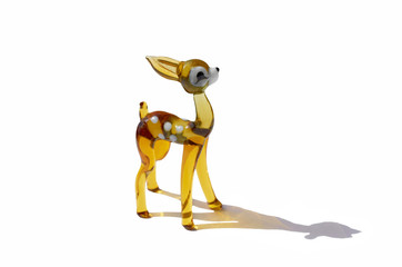glass figurine fawn with a broken ear isolated on a white background with a shadow
