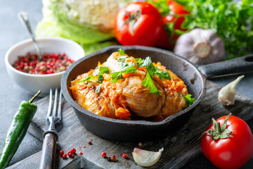 Cabbage rolls with minced meat and tomato sauce.
