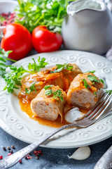 Cabbage rolls stuffed with ground beef and rice.