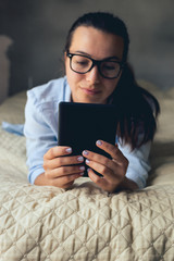 Young woman looking ebook