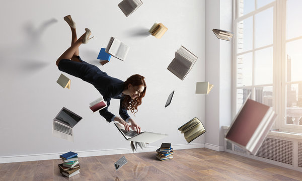 Joyful Beautiful Young Levitating Businesswoman