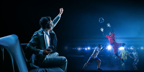 Businessman playing football video game