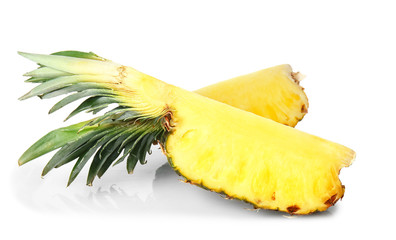 Ripe cut pineapple on white background