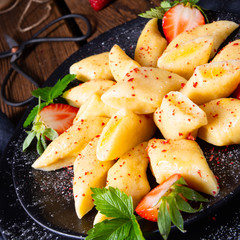 Kopytka - polish potato dumpling with strawberries
