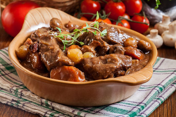 Beef Bourguignon stew served with baguette