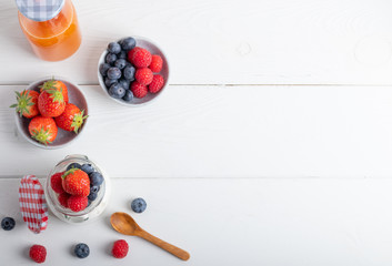 Naklejka na ściany i meble yogurt with fruit on a breakfast table on a white background