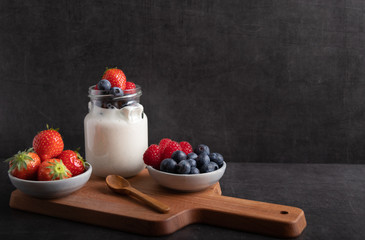 yogurt with fruit on a breakfast table
