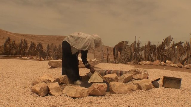 Bedouin woman bakes traditional handmade bread