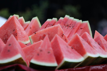 Watermelon cut into triangular pieces, put together.