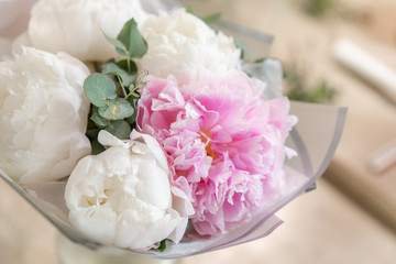 White and pink peonies in a metal vase. Beautiful peony flower for catalog or online store. Floral shop concept . Beautiful fresh cut bouquet. Flowers delivery