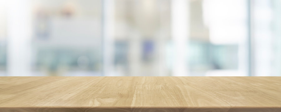 Empty wood table top and blurred bokeh restaurant interior background - can used for display or montage your products.