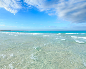 Sea surf on beach.