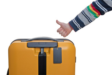 Child's hand with thumb up and a suitcase with a label