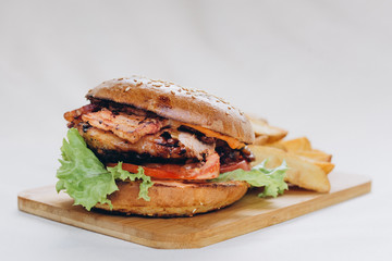 Fresh tasty chicken burger on wood table