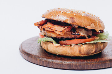 Fresh tasty chicken burger on wood table