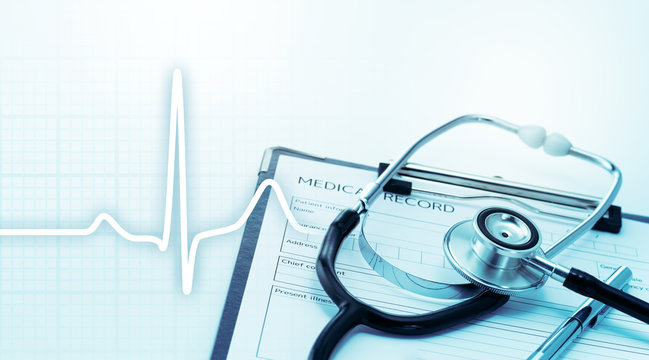 Stethoscope and heartbeat.  Health care and Medical concept. Stethoscope on medical record.