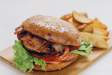 Big tasty burger on background on the wooden table