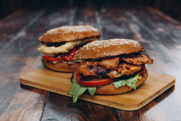 Big tasty burger on background on the wooden table
