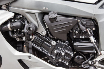 Engine parts of a racing motorcycle close-up.