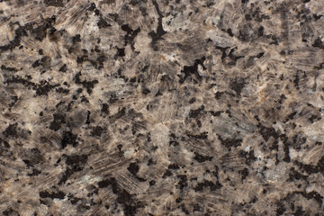Fototapeta na wymiar Natural stone beige granite with black spots
