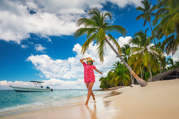 Happy woman having fun on tropical island beach, Punta Cana Dominican Republic - obrazy, fototapety, plakaty