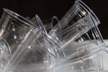 Many plastic water glasses in the pile, recycling concept - Image
