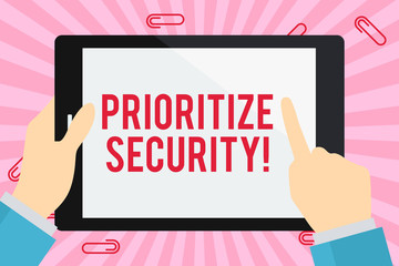 Word writing text Prioritize Security. Business photo showcasing designate security risk as more important to solve Businessman Hand Holding, Pointing and Touching Colorful Tablet Blank Screen