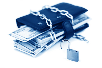 Business safety or financial protection or allow access. Heap of money in chain with open padlock...