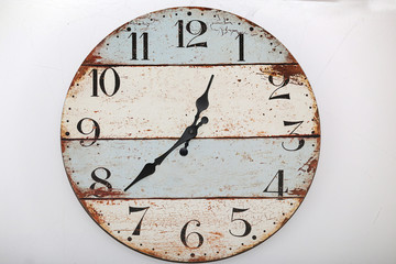 Old wooden wall clock on white background