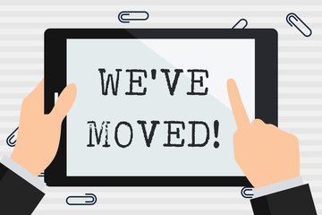 Handwriting text We Ve Moved. Conceptual photo having strong feelings sadness or sympathy has said or done Businessman Hand Holding, Pointing and Touching Colorful Tablet Blank Screen