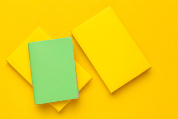 Books on a yellow background