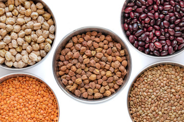 Chickpea, Red Lentil, Split Chickpea, Black gram,  Black lentil, Garbanzo Beans, Horse Gram, Gahat Dal in steel bowel isolated on white background.