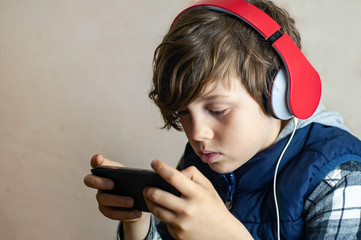 Fascinated fashionable teenager playing an Internet game. Of dependence children from online games....