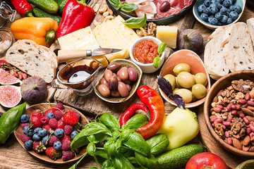 Top view table full of food. Italian antipasti wine snacks set over wooden background
