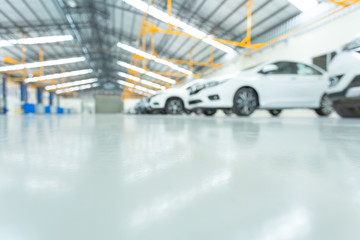 epoxy floor in interior car, interior car-care center. cars in the service put on the epoxy floor, The electric lift for cars.