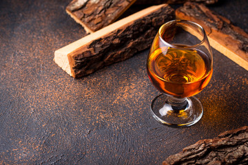 Glass of cognac or whiskey.