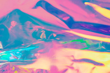 Blurry abstract iridescent holographic foil background