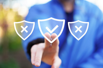 Businessman presses button active security shield virus on virtual electronic user interface.