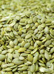 Macro background texture of green pumpkin seeds