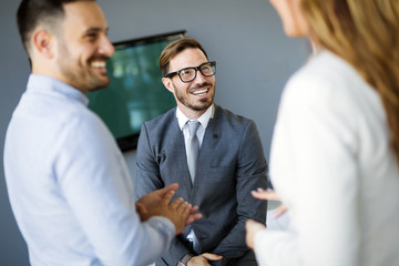 Picture of business colleagues talking in office