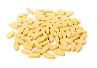 vitamin C tablets on white background