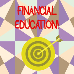 Writing note showing Financial Education. Business concept for education and understanding of various financial areas Dart Board in Concentric Style with Arrow Hitting the Center Bulls Eye