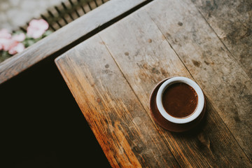 cup of coffee on wooden table