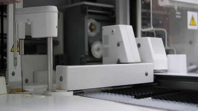 Robotic medicine equipment for blood analysis with a long pintle in a laboratory  