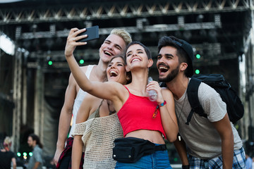 Fototapeta premium Happy friends having fun at music festival
