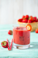 strawberry smoothie on wooden surface