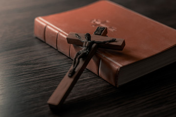Old Holy Bible and Crucifix. Concept for religious events