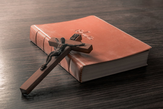 Old Holy Bible and Crucifix. Concept for religious events