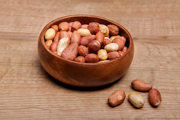  Peanut in a bowls on wooden table.Healthy food and snack.
