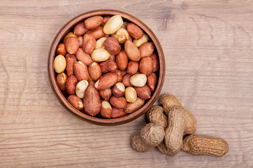  Peanut in a bowls on wooden table.Healthy food and snack.